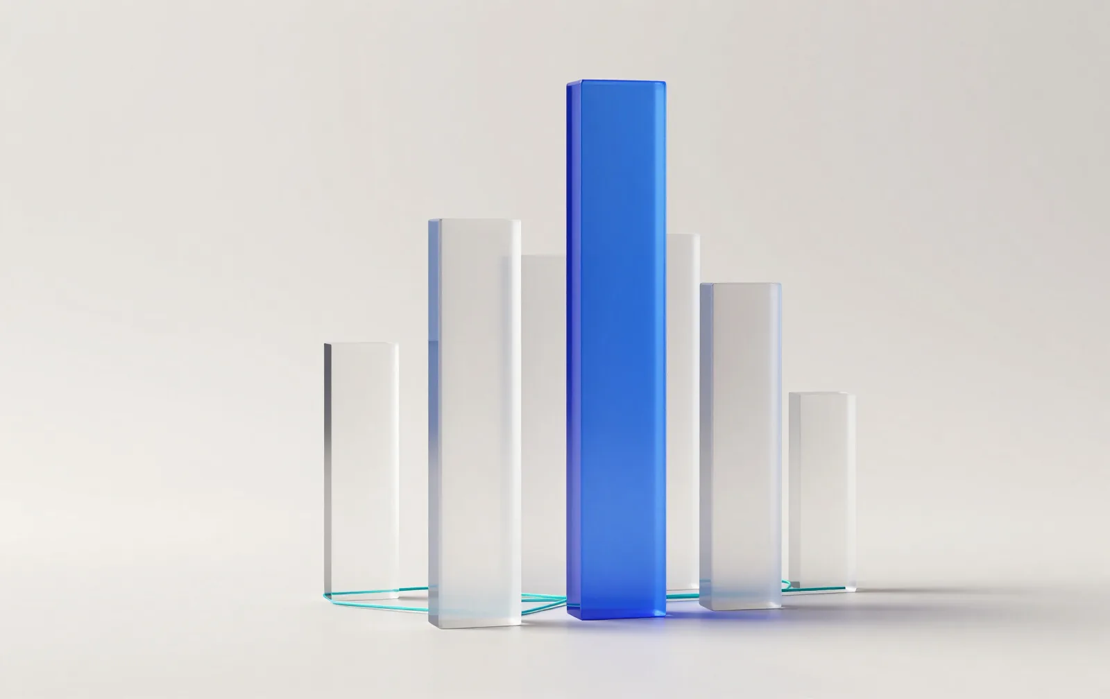 Glass columns of different heights, one glowing cobalt, joined by thin lines of light